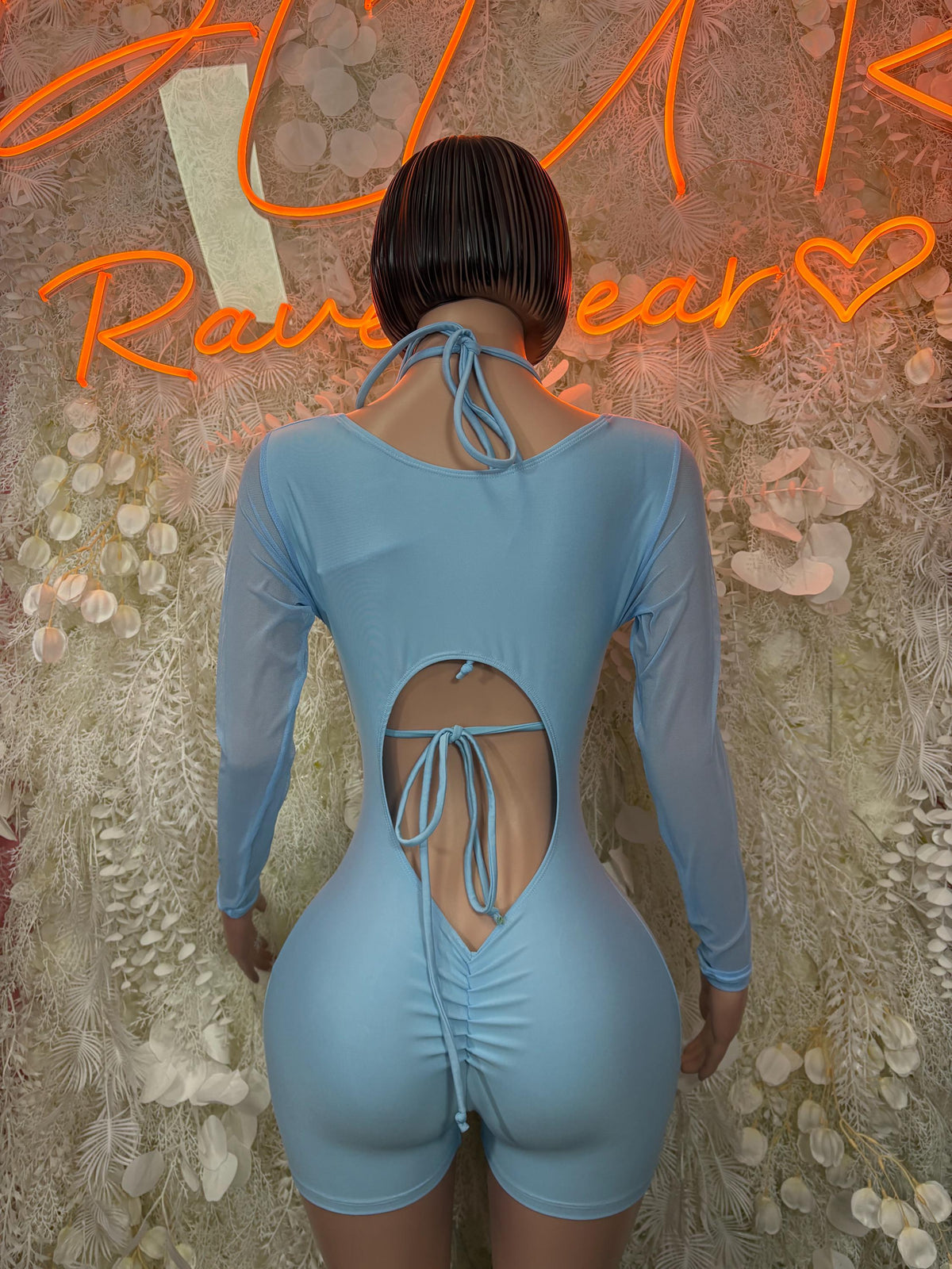 Bottlegirl light blue one-piece bodysuit with long sleeves and lace-up open back