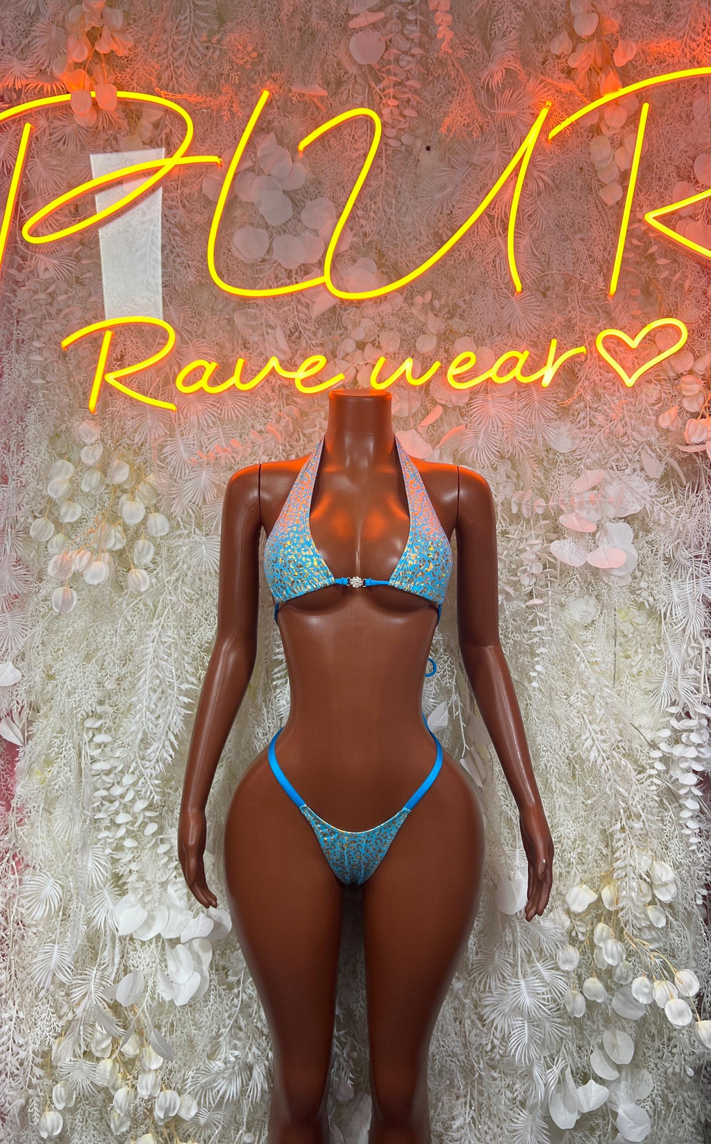 Turquoise two-piece bikini set with patterned triangle bra and matching thong bottoms