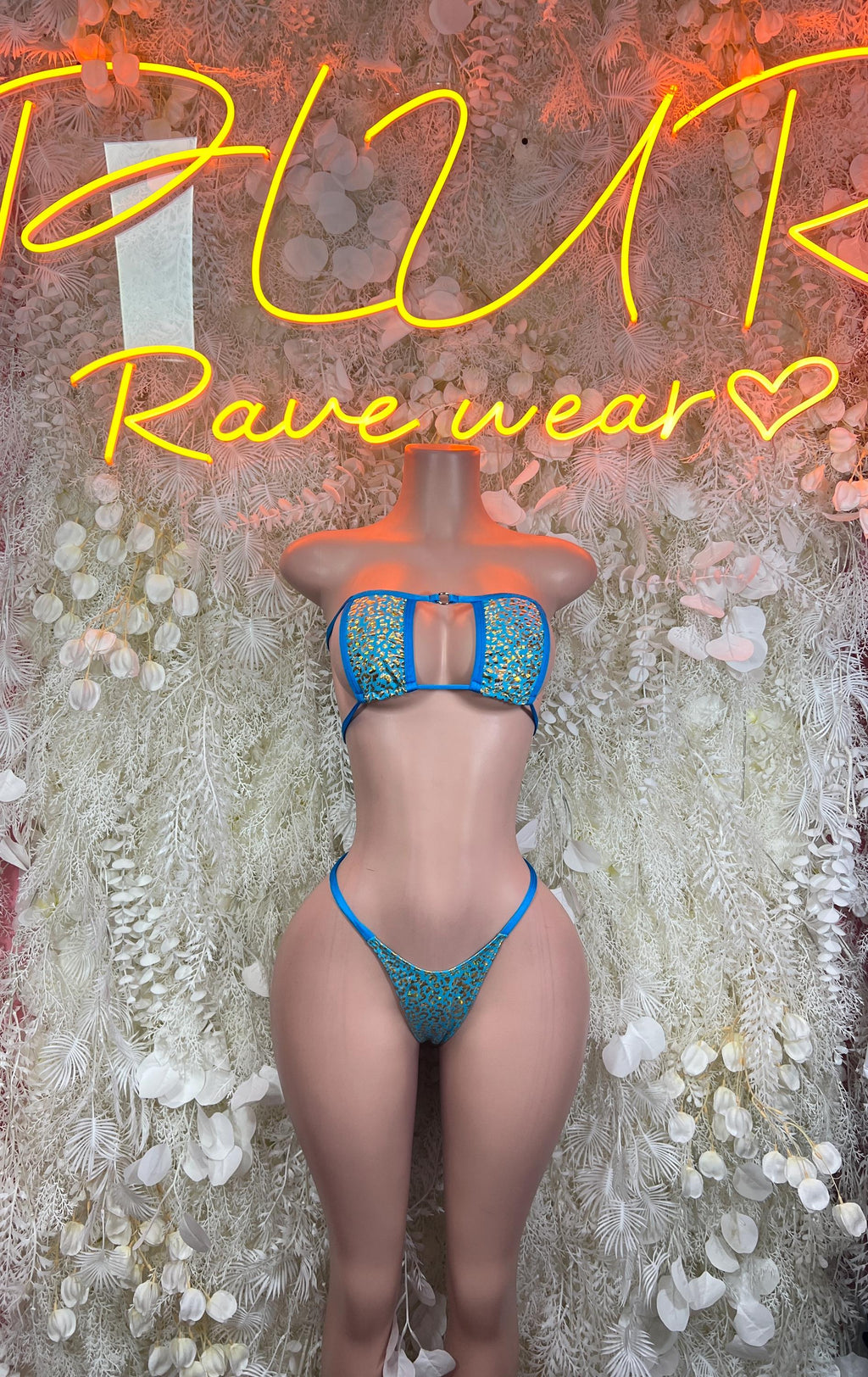 Turquoise patterned bikini set with bandeau top and tied string cheeky bottoms