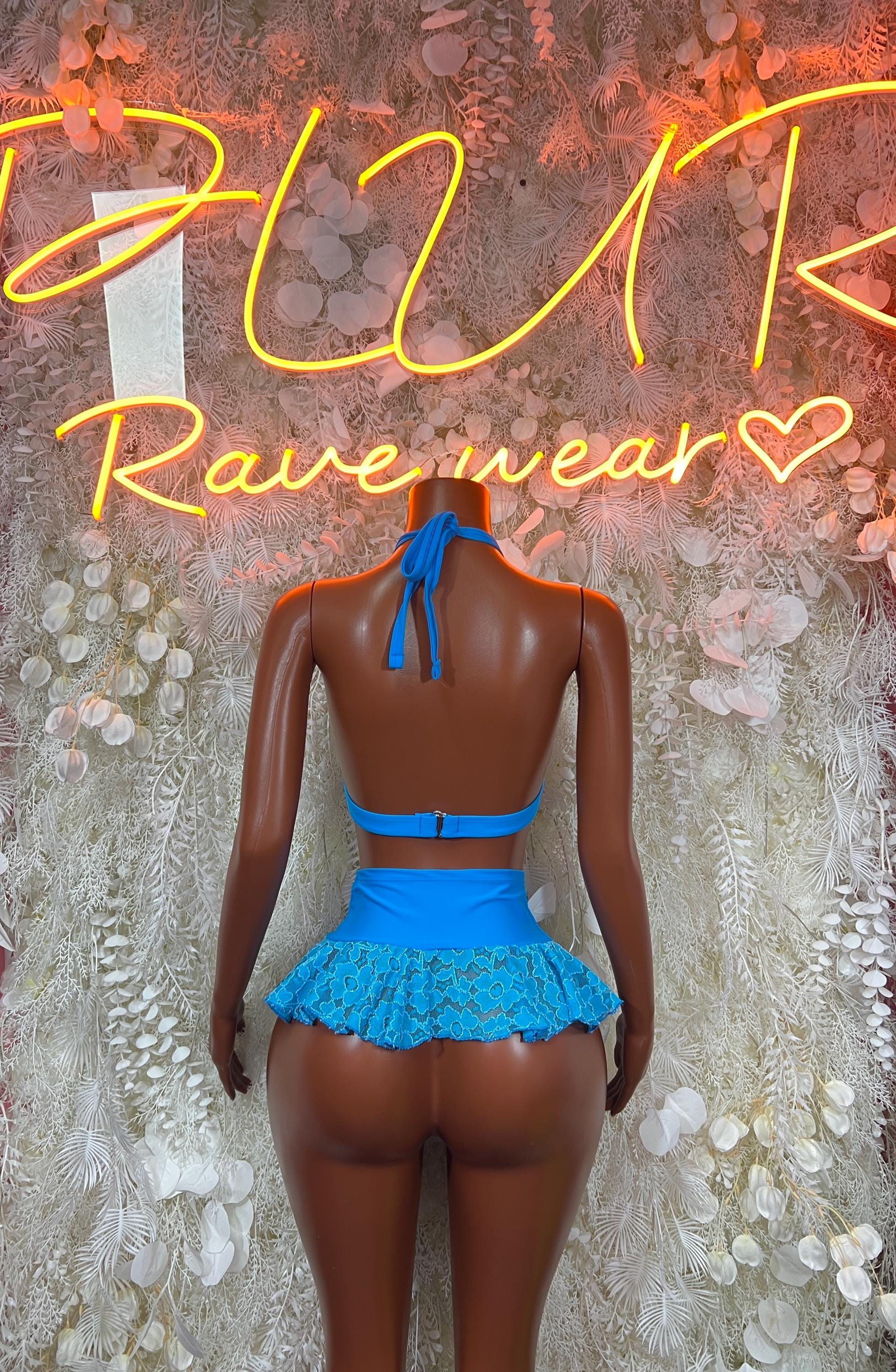 Blue two-piece skirt set with lace halter bra and layered mini skirt, back view
