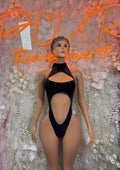 Black velvet one-piece bodysuit with halter neck and front cutout