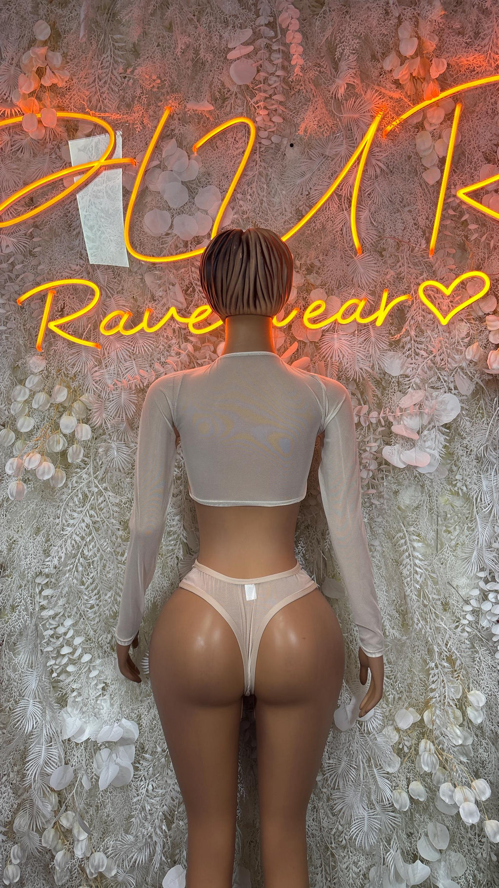 Nude mesh dance set back view: long-sleeve crop top and high-cut briefs with ties.