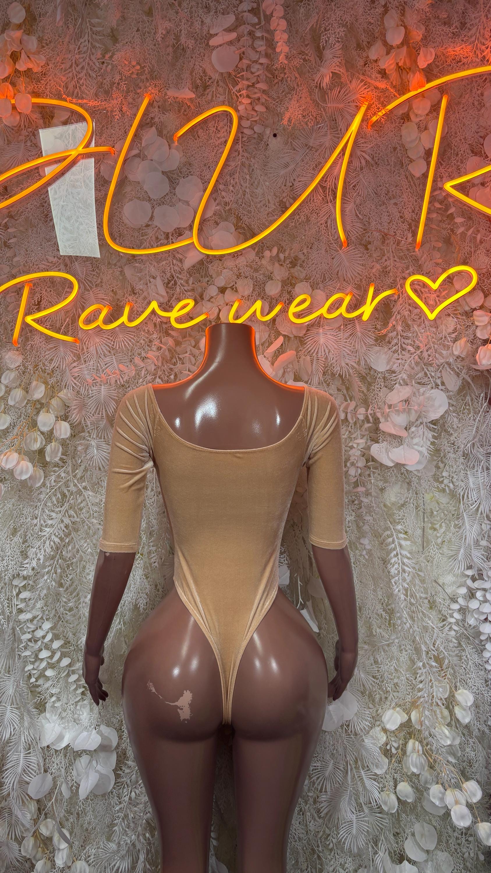 Nude velvet long-sleeve one-piece bodysuit with front lace-up and deep V neckline