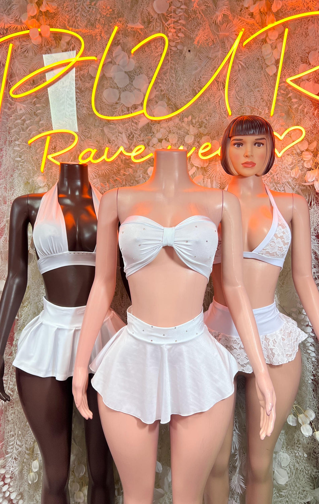 White two-piece rave outfit set: bow-front bandeau crop top and flared mini skirt
