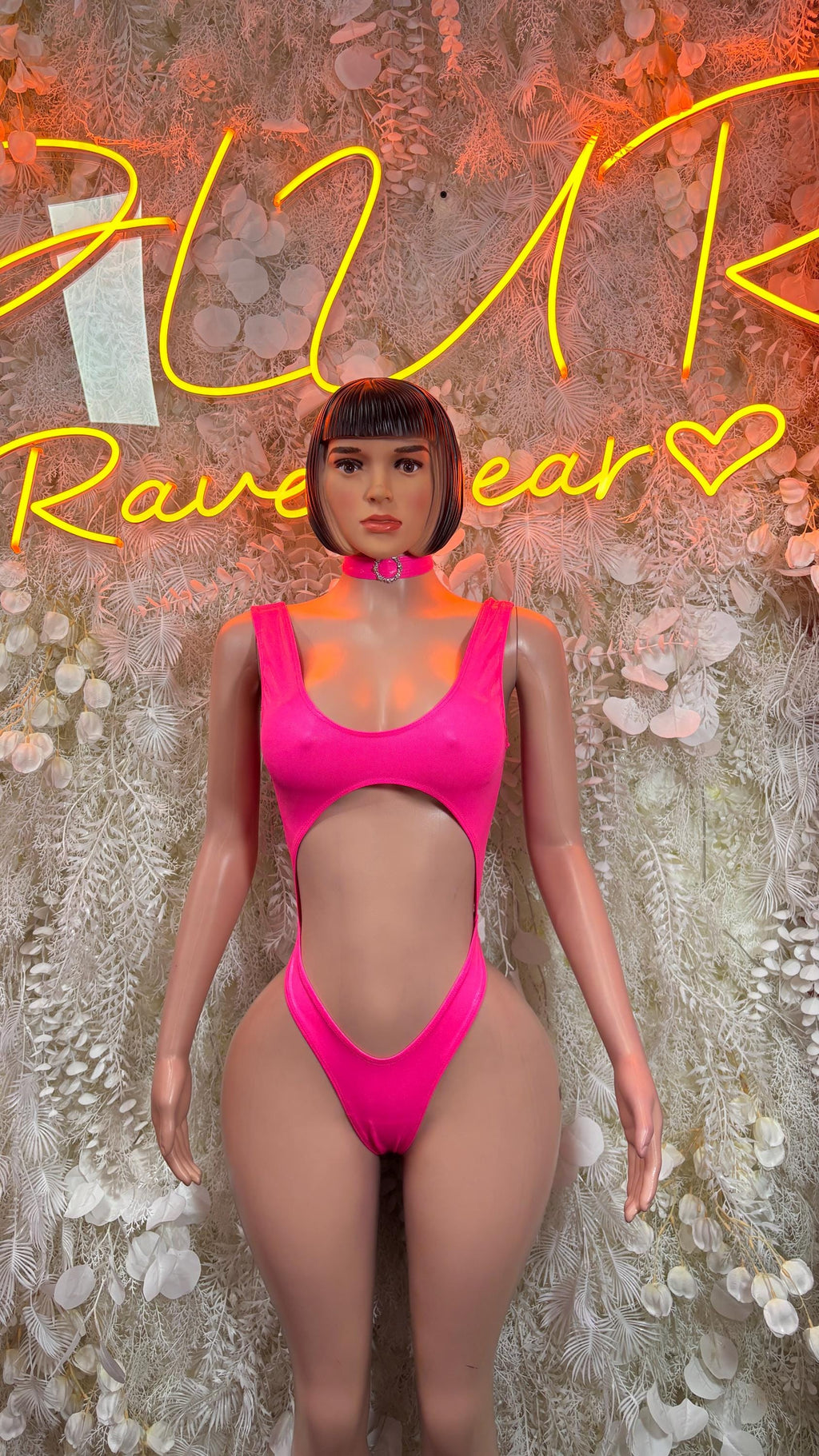 Hot pink bodysuit with choker neckline, sleeveless with cheeky cut