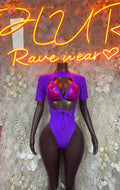 Purple one-piece dance outfit with cutout back, short sleeves, and pink mesh straps in front