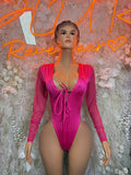 Pink long-sleeve bodysuit with V-neck and lace-up front