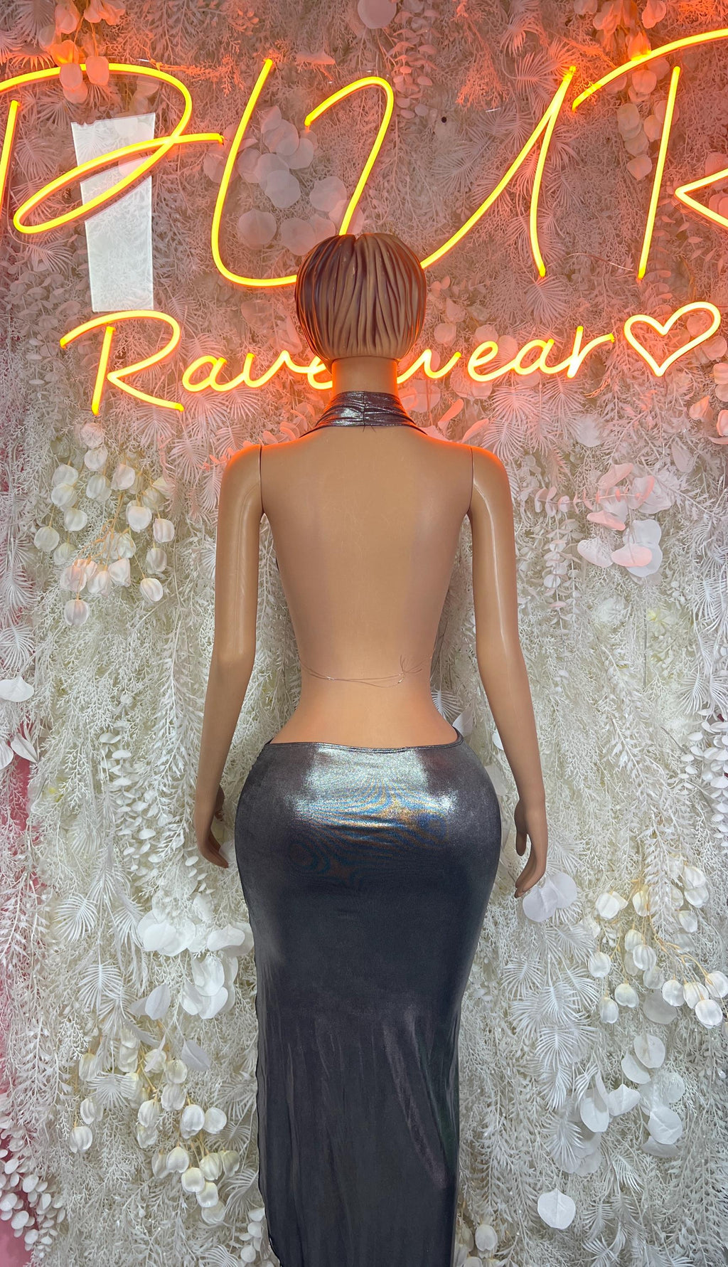 Women’s metallic silver backless gown with halter straps and draped back