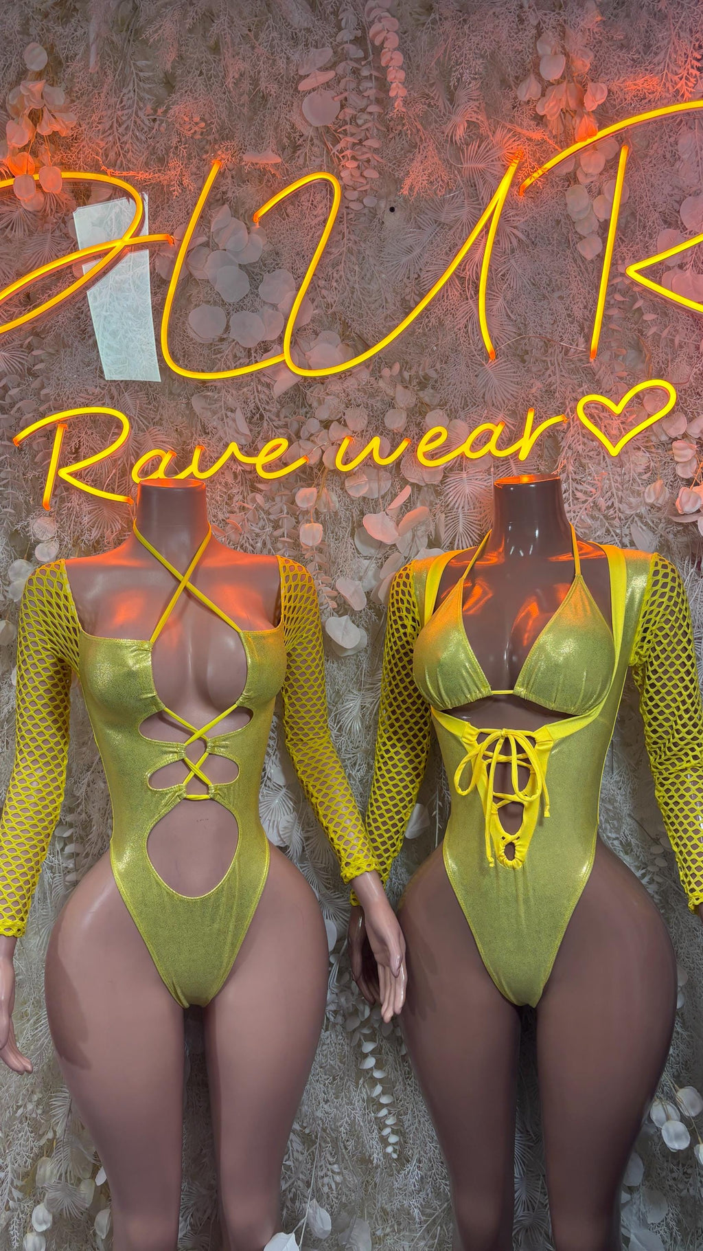 Two yellow metallic bodysuits with lace-up cutout chest and long fishnet sleeves