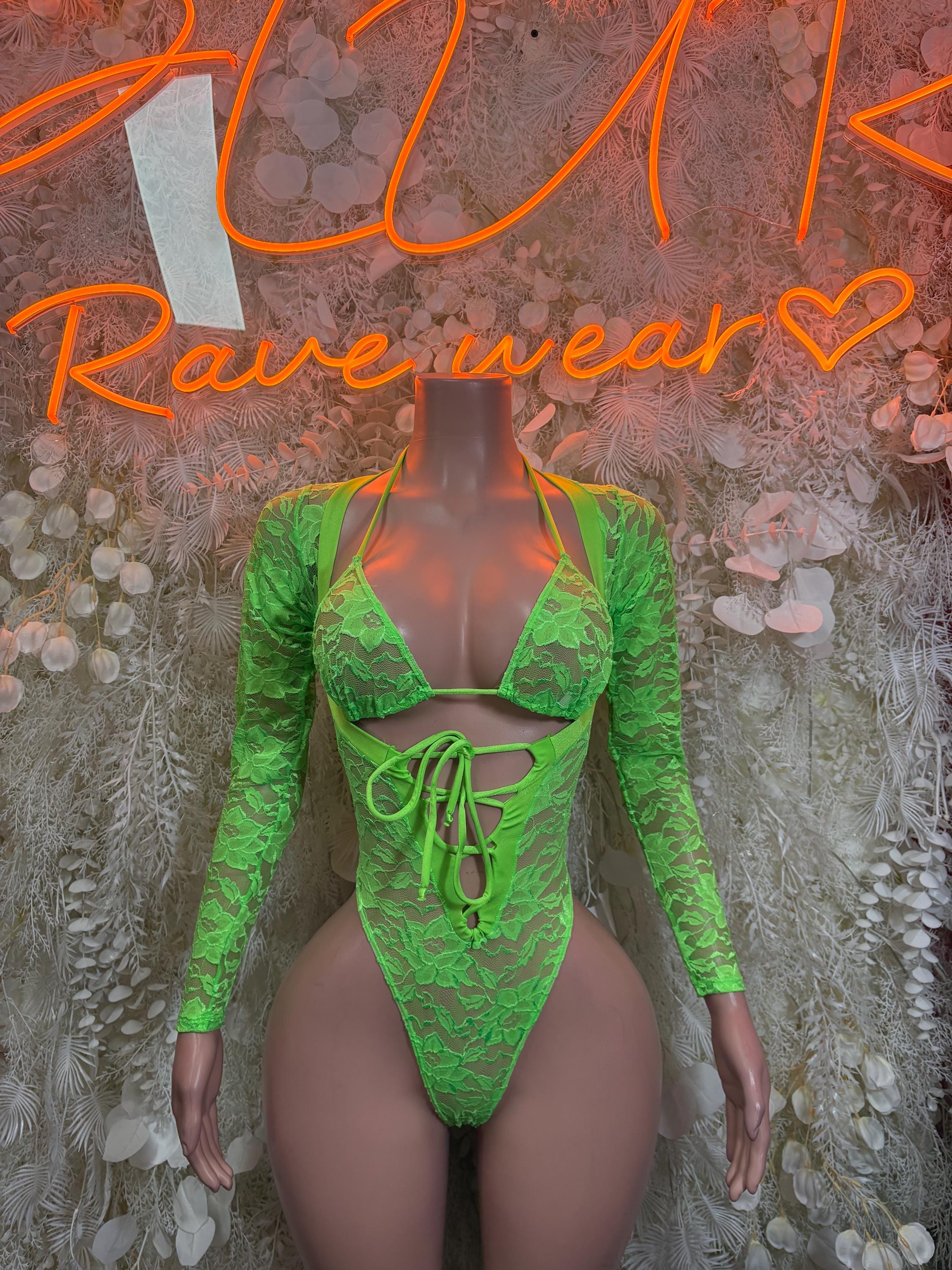 Neon green lace bodysuit with long sleeves, lace-up front and thong back
