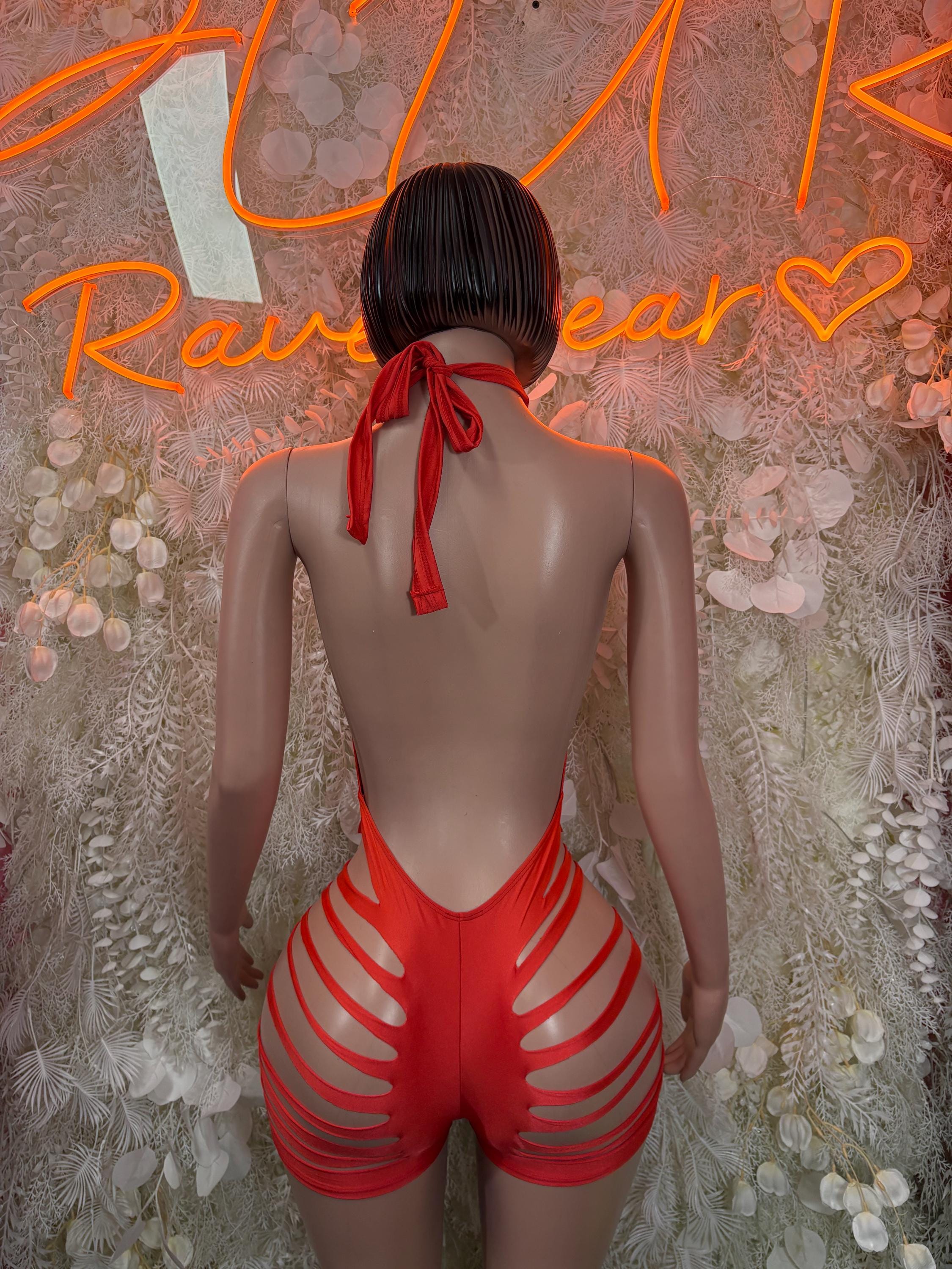 Back view of red halter bodysuit with tie strap and striped shorts