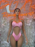 Pink one-piece bodysuit with heart bow front and halter straps