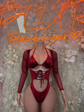 Red velvet halter bodysuit with long sleeves, lace-up front and deep V cutout