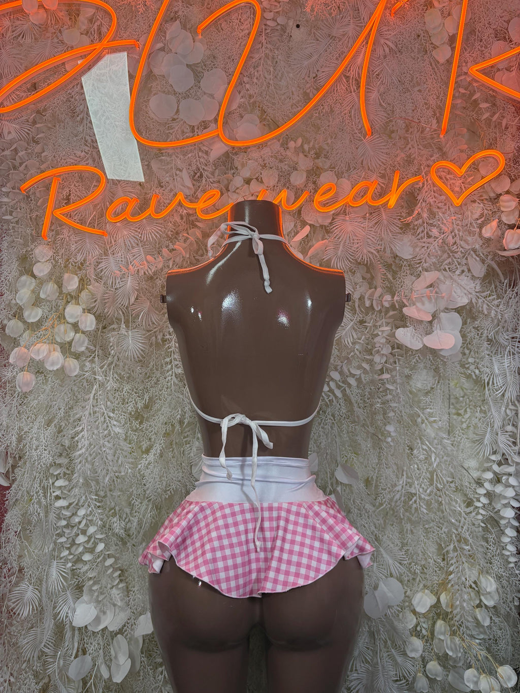 Pink plaid mini skirt set with black bikini halter top and tied straps