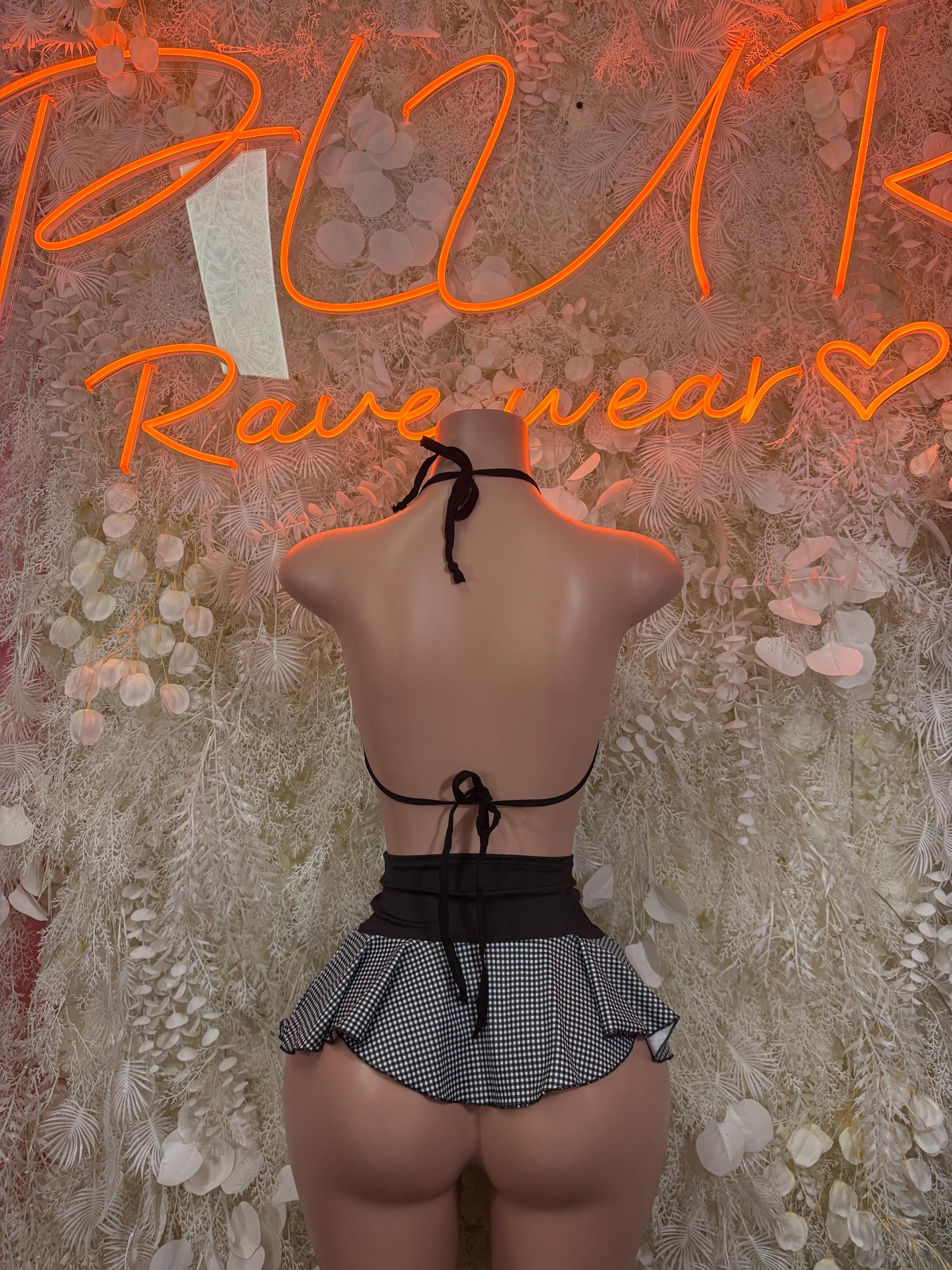 Rave outfit two-piece skirt set, back view: black tie bikini top and pleated check mini skirt