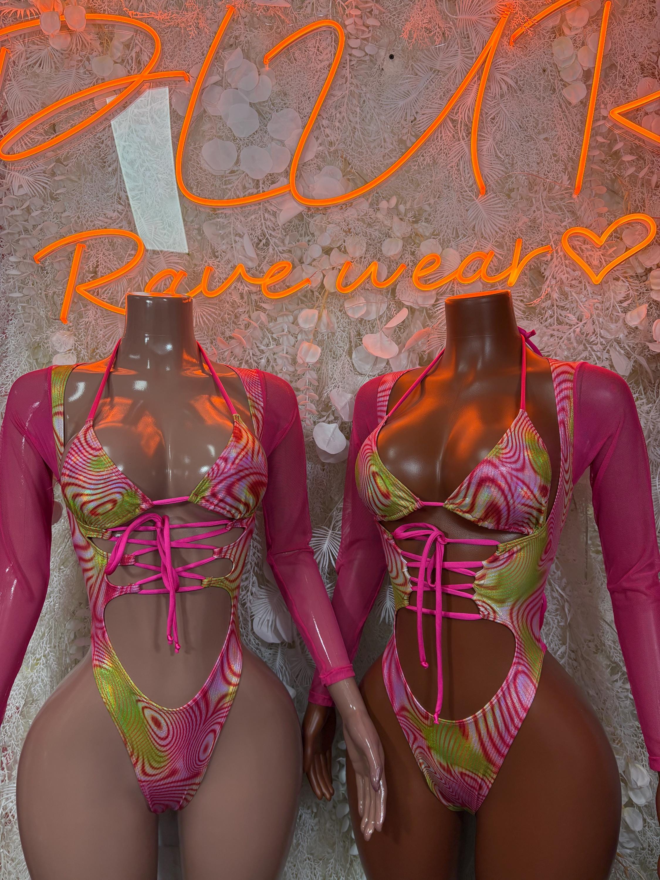 Neon pink-green bodysuit front detail with long sleeves and crisscross lace-up front