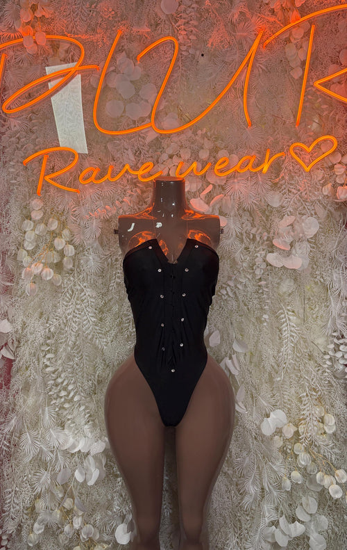 Black V-neck bodysuit with button details and high-leg thong cut