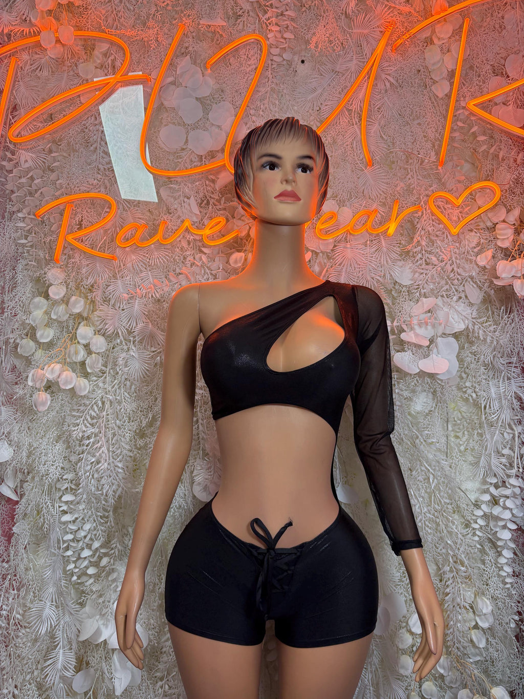 Black two-piece dance set with long-sleeve cutout crop top and tie-front shorts