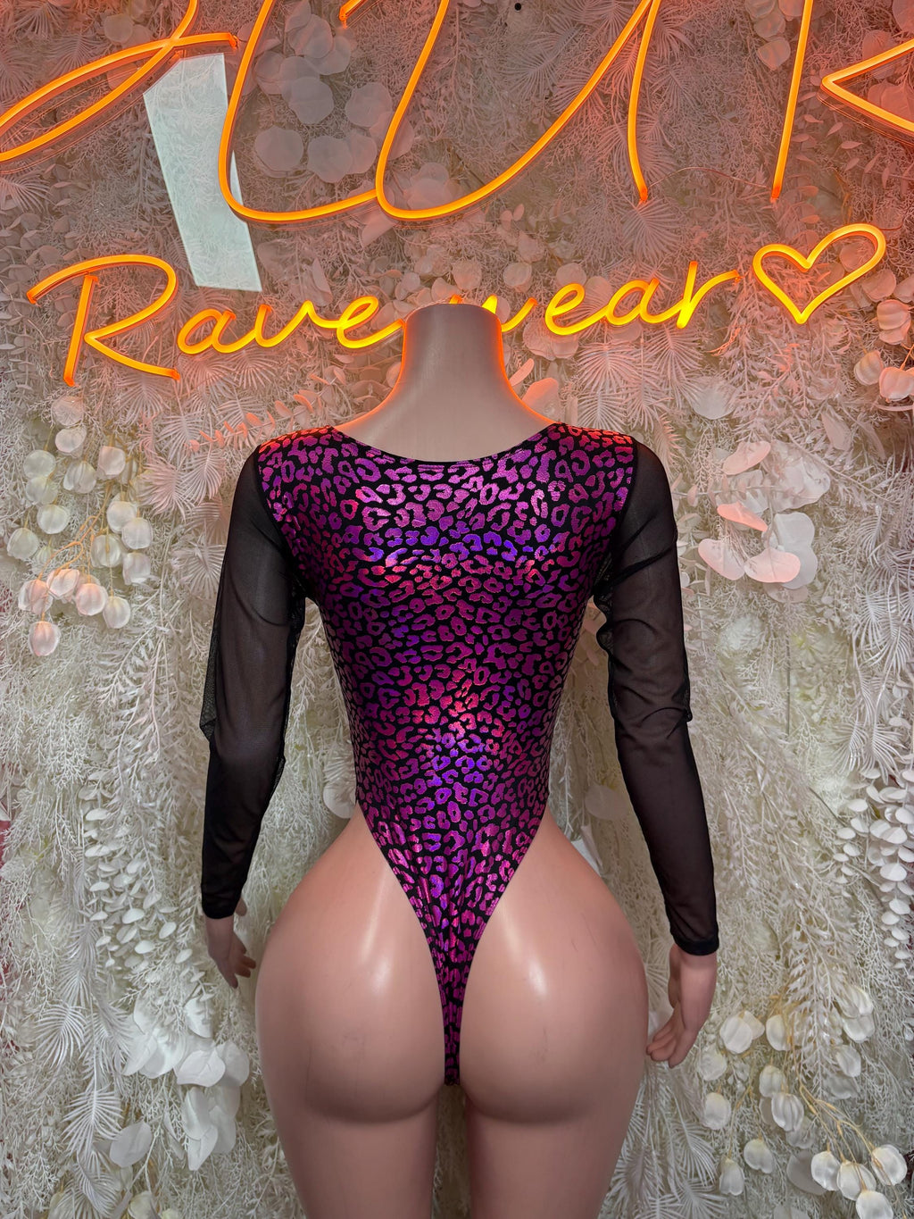Purple leopard one-piece bodysuit with long sheer sleeves and open back