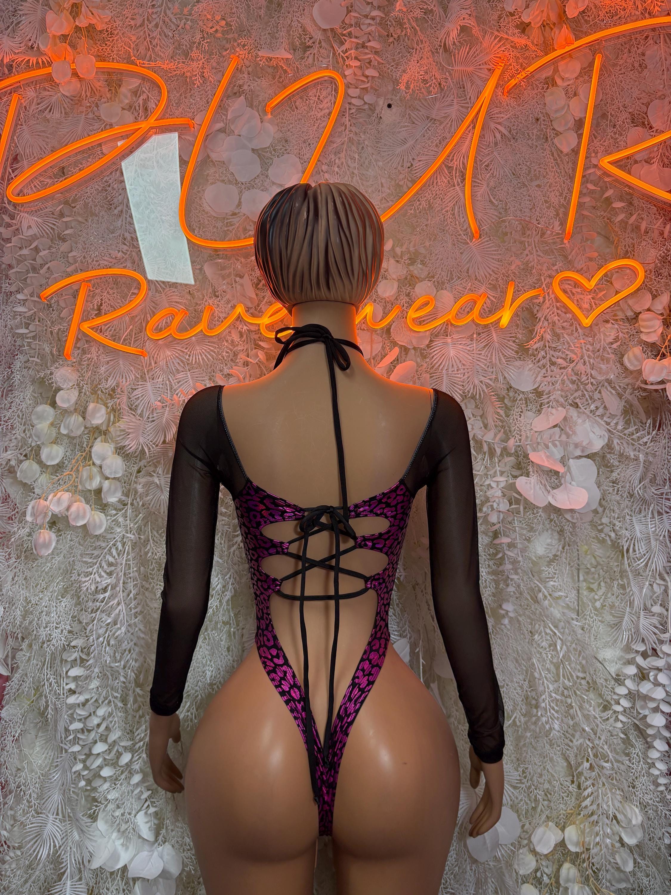 Purple cheetah-print one-piece bodysuit with open back lace-up and sheer black sleeves