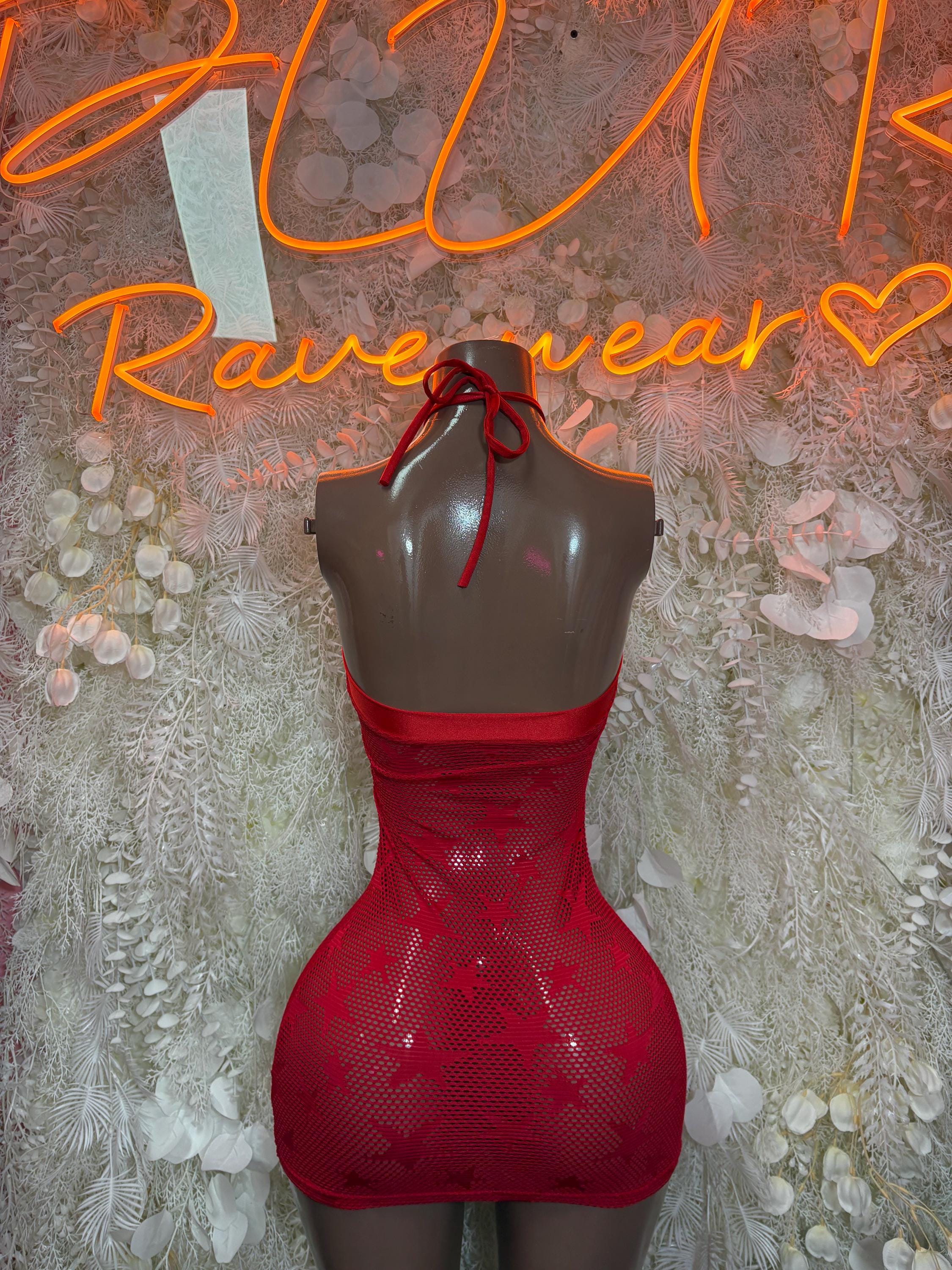 Red mini dress with open back and tie straps, fitted bodycon silhouette