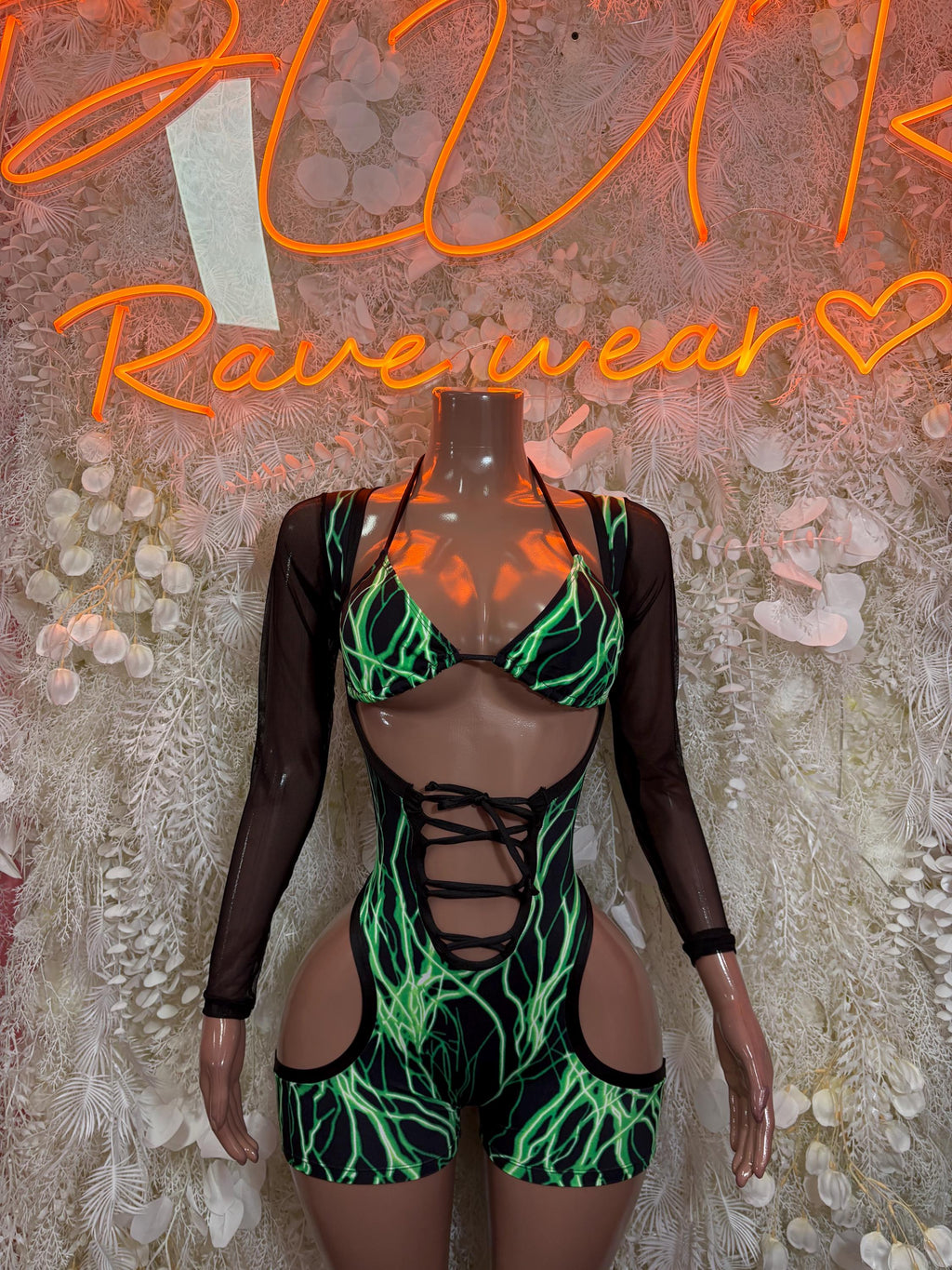 Green neon graphic one-piece bodysuit with long sleeves, lace-up front and cutouts