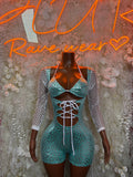 Turquoise cheetah-print bodysuit with long mesh sleeves and front lace-up