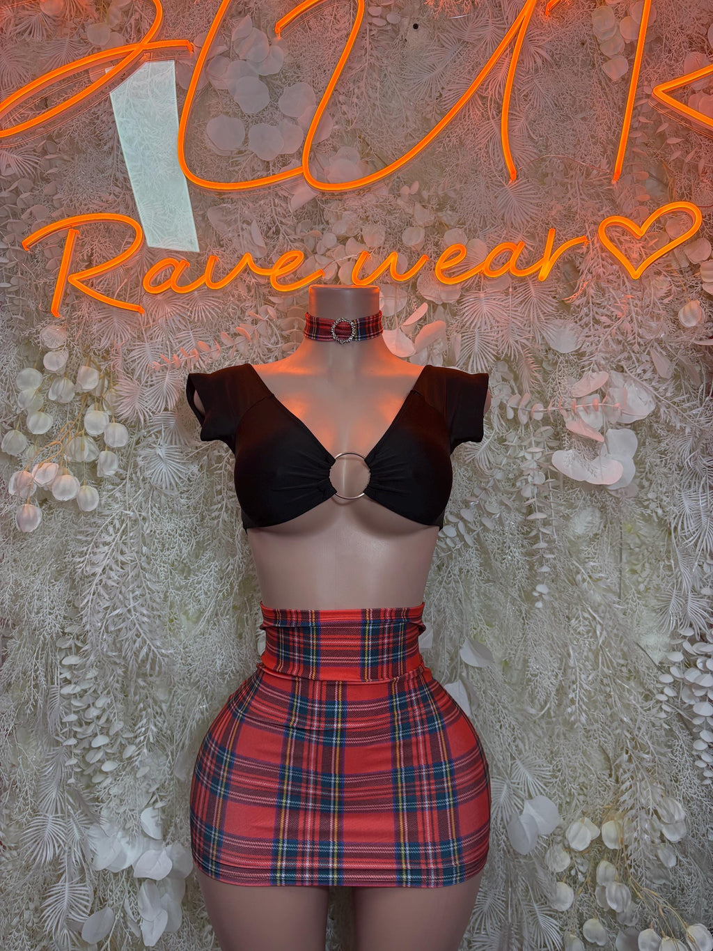 Two-piece skirt set: black underwired crop top and red plaid mini skirt