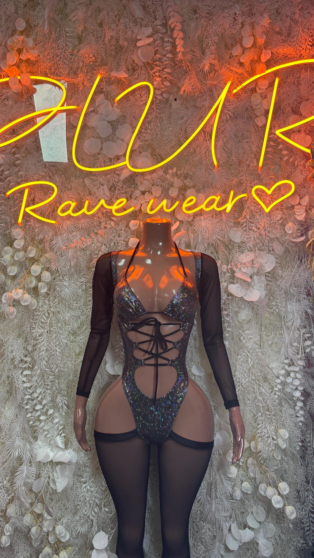 Metallic black long-sleeve bodysuit with lace-up front and sheer cutout panels