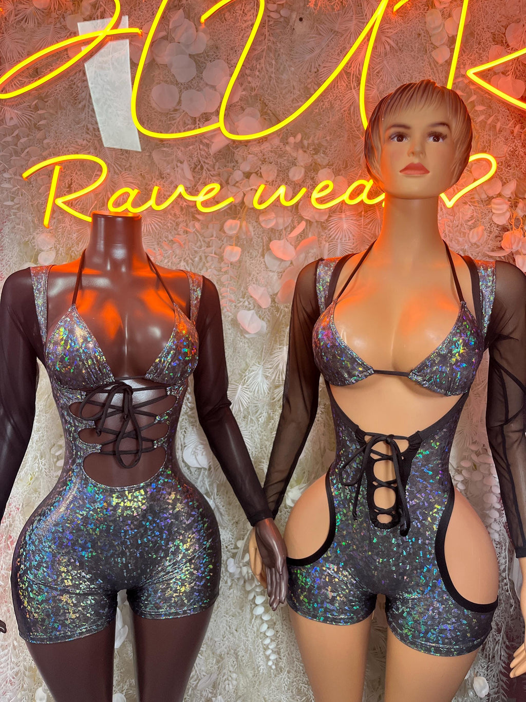 Sparkly iridescent bodysuit with black long sleeves and crisscross lace-up chest and cutout