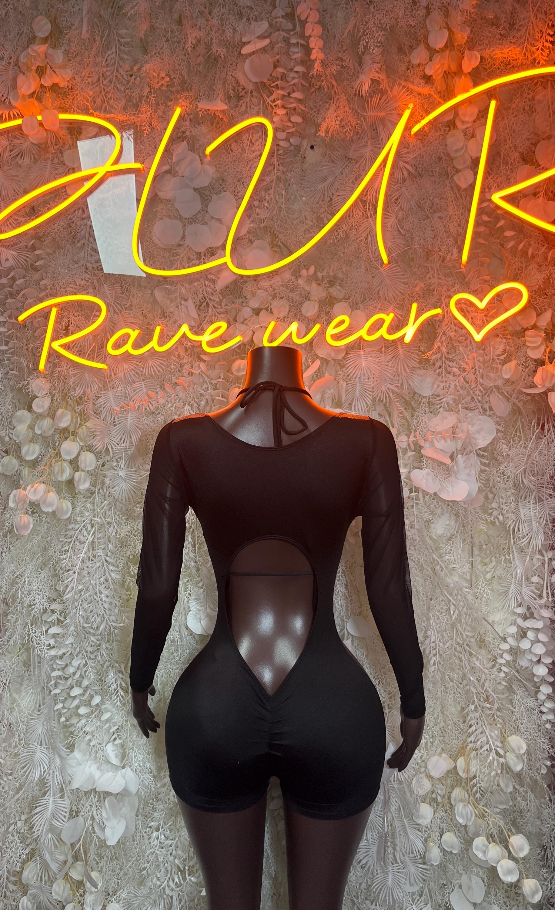 Black long-sleeve unitard with deep V neckline and fitted shorts