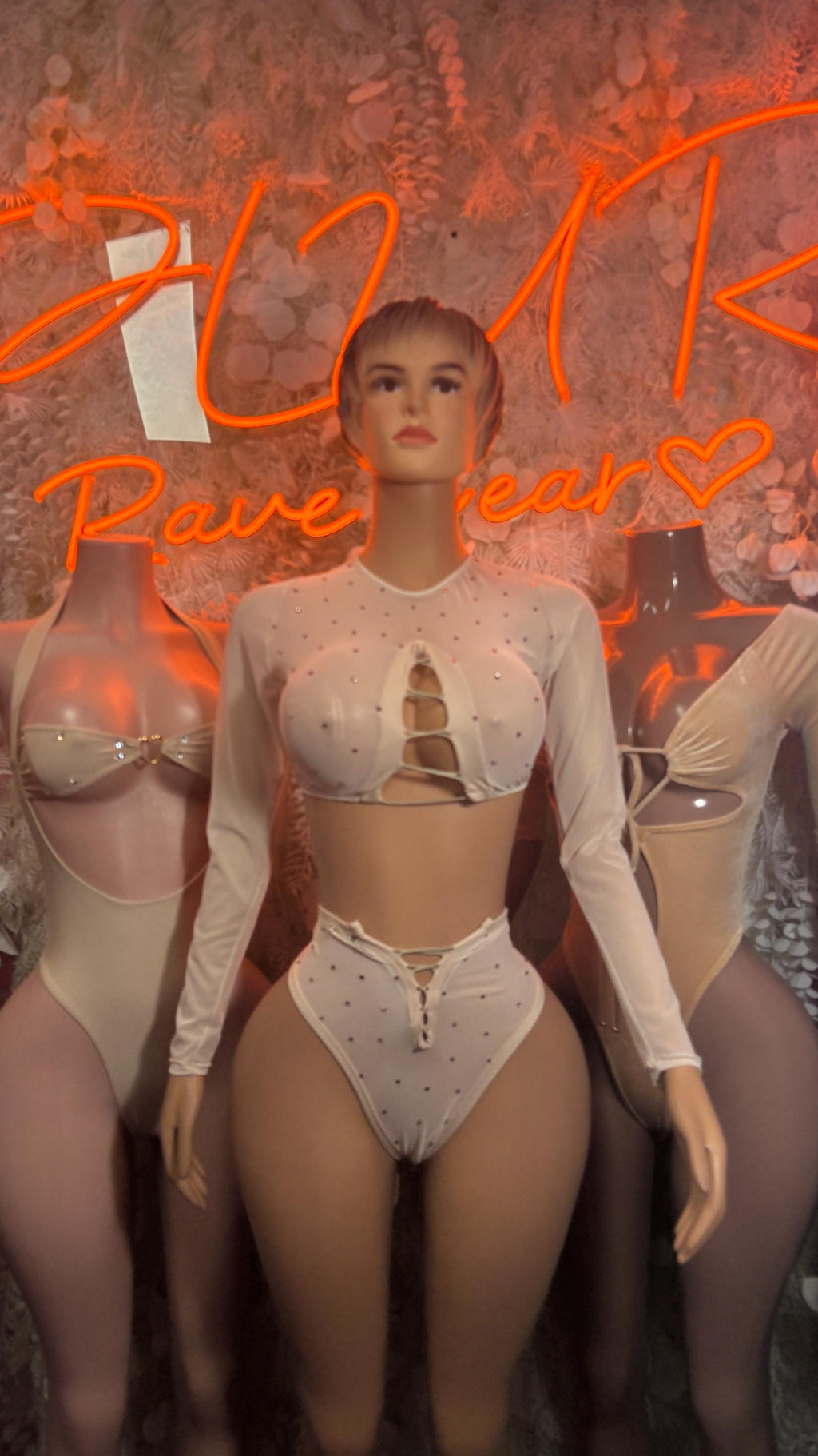 Light-colored velvet long-sleeve one-piece bodysuit with front keyhole lace-up