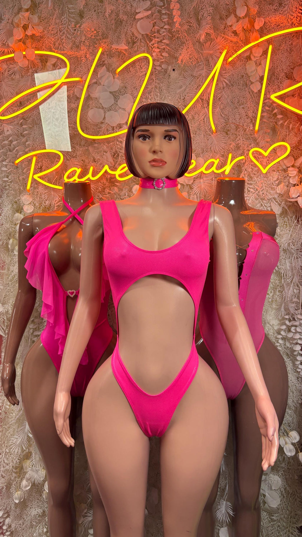 Hot pink one-piece bodysuit with scoop neckline and high-cut leg openings