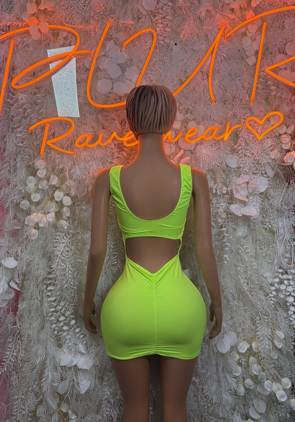 Neon green ruched mini dress with halter straps and open back