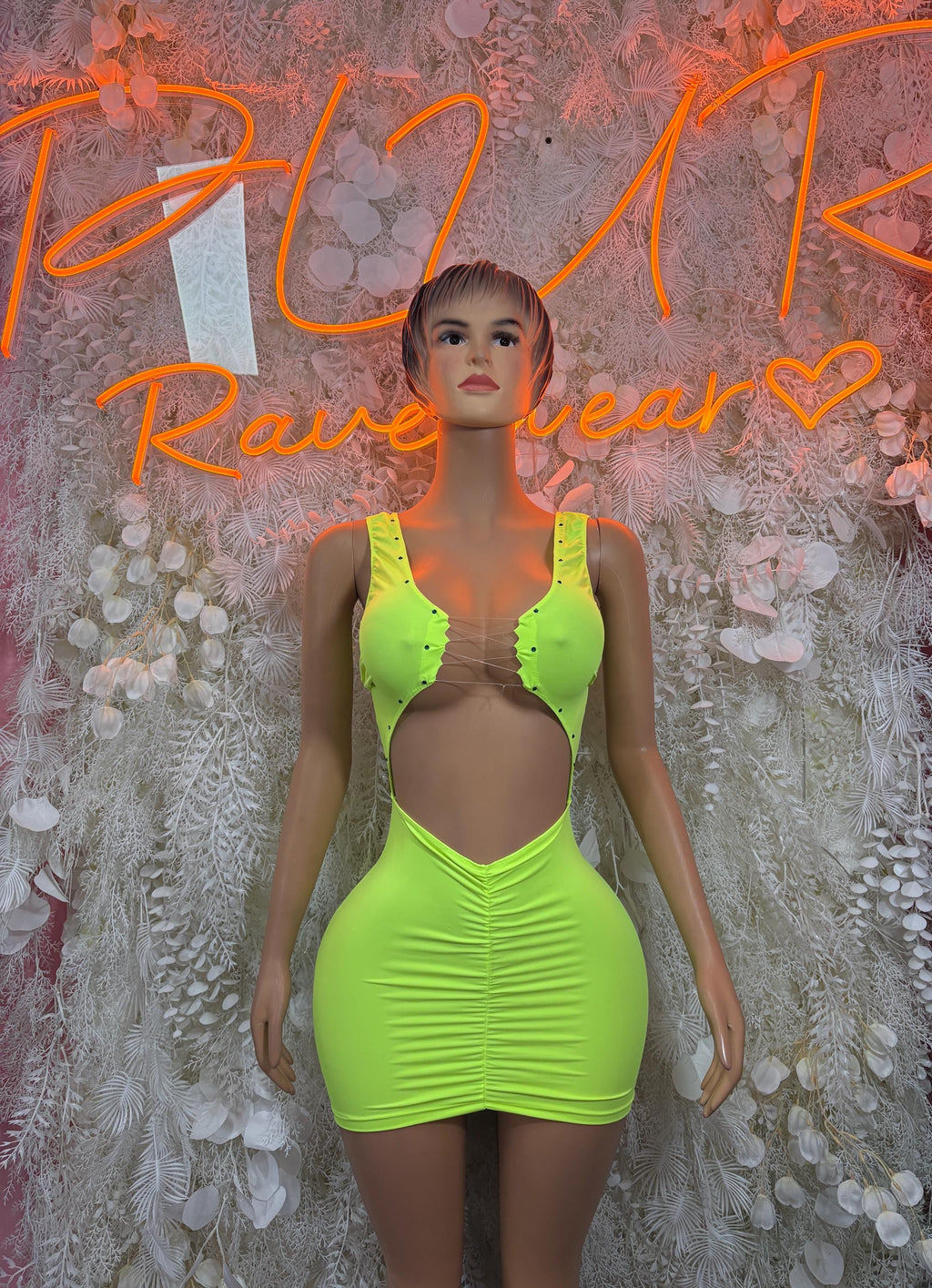 Neon green ruched mini club dress with halter neckline and scooped front