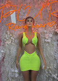 Neon green ruched mini club dress with halter neckline and scooped front