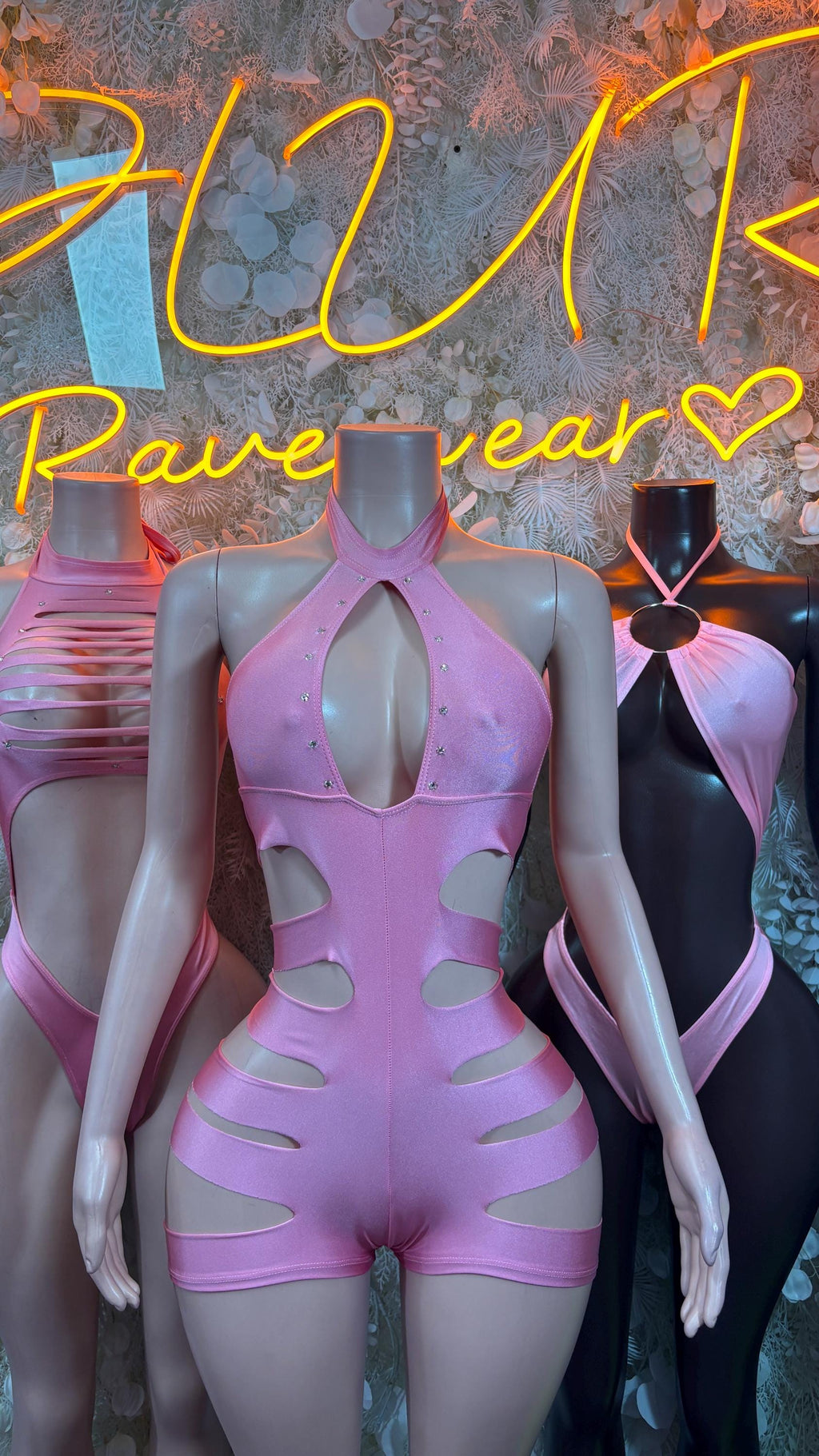 Baby pink cutout halter bodysuit with chest keyhole and sculpted cutout panels