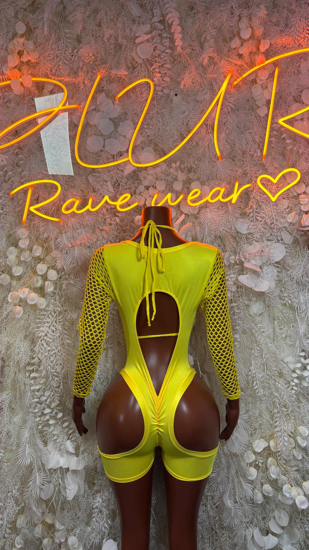 Metallic yellow bodysuit with open back and crisscross lace-up