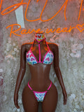 Rave-style bikini set with heart print triangle top and matching thong bottoms