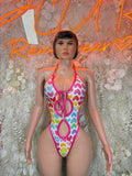 Heart print one-piece bodysuit with pink trim, halter tie front, multicolor hearts