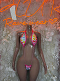 Heart-shaped cutout bodysuit with multicolor hearts print and pink trim, backless look