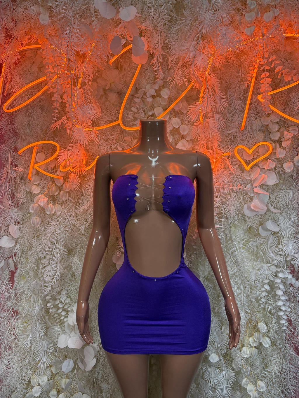 Purple fitted mini dress with sweetheart neckline, button detailing and deep back cutout