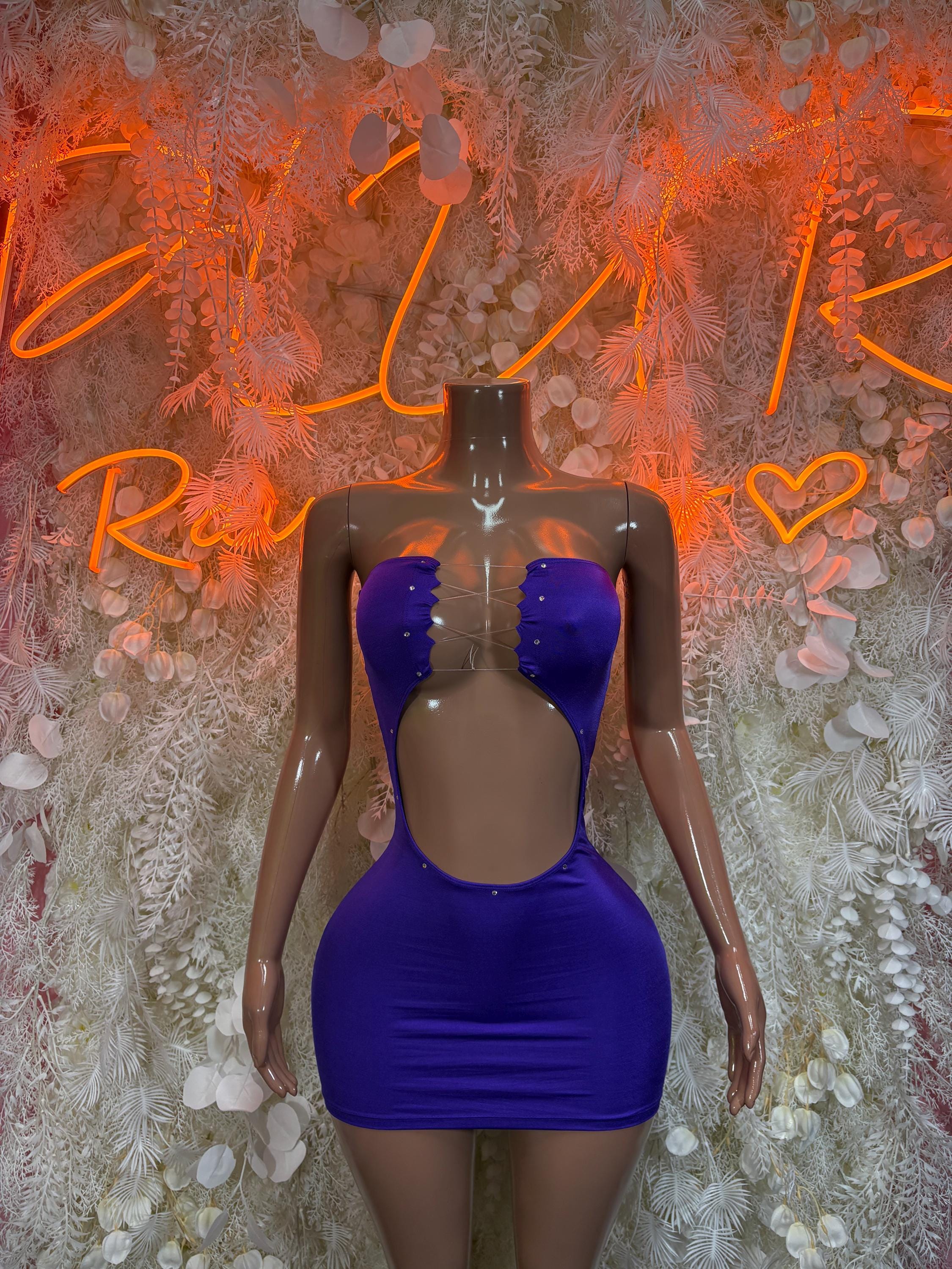 Purple fitted mini dress with sweetheart neckline, button detailing and deep back cutout