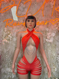 Red halter bodysuit with crisscross wrap front, silver chain detail, striped shorts