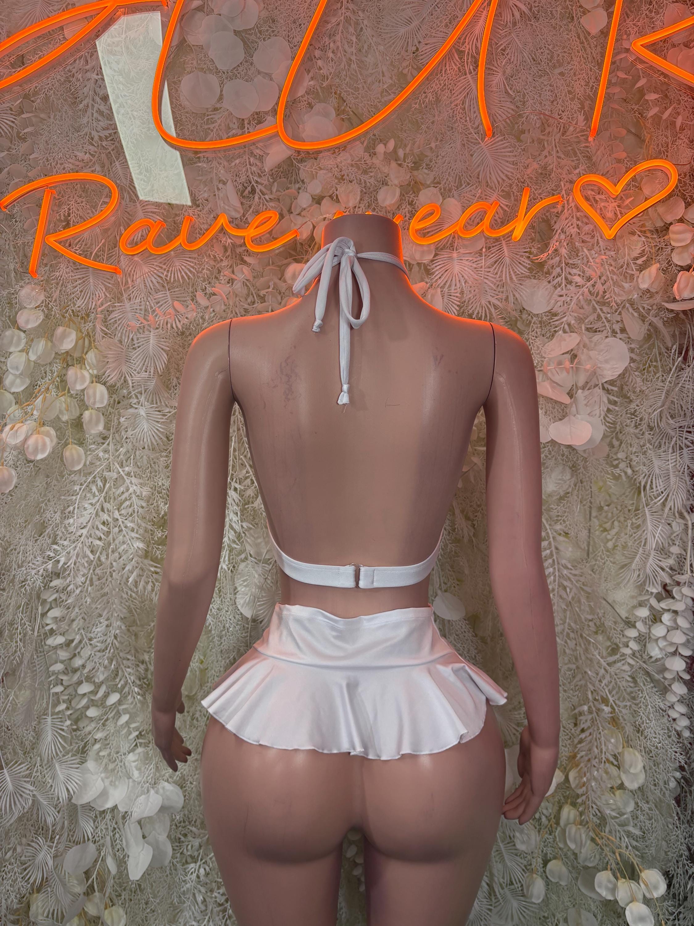 White cross-back bikini top and ruffled mini skirt with drawstring ties