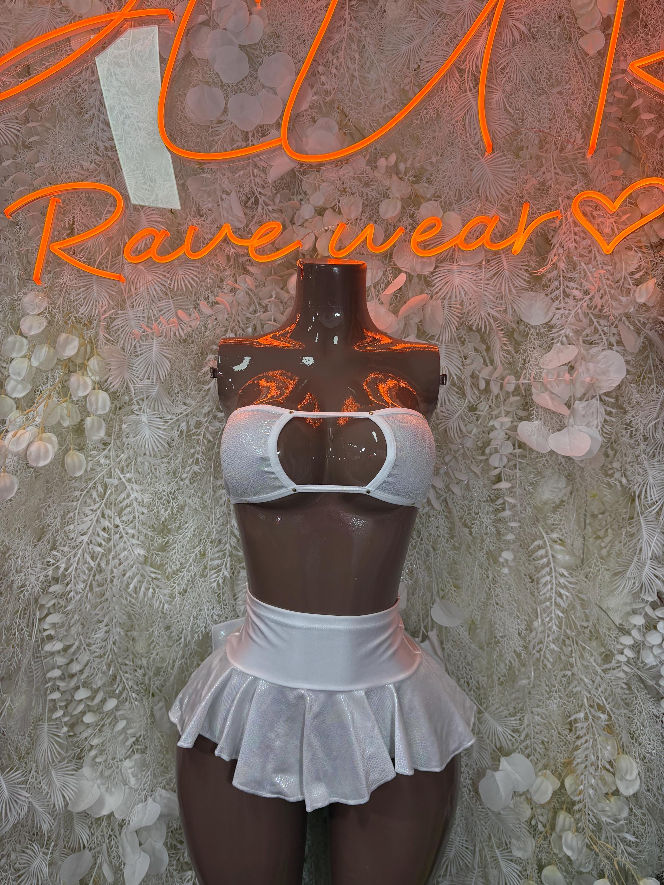 White two-piece skirt set with halter bralette and ruffled micro-skirt