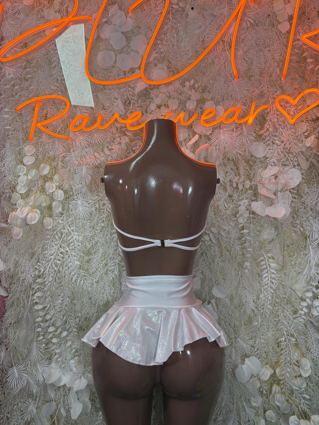 White two-piece skirt set with strappy back bralette and layered ruffle skirt