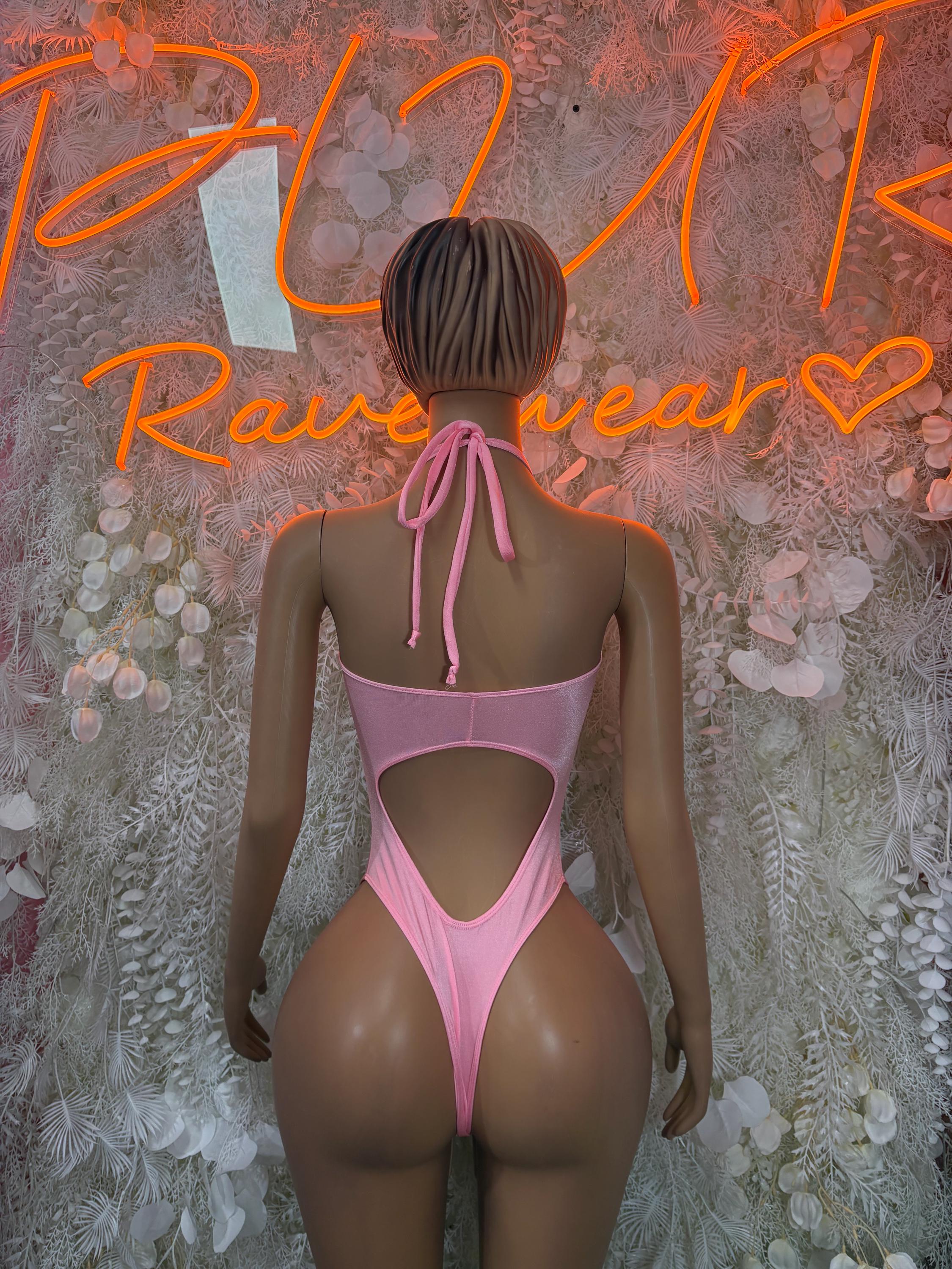 Pink one-piece bodysuit with open back and tie straps at neck