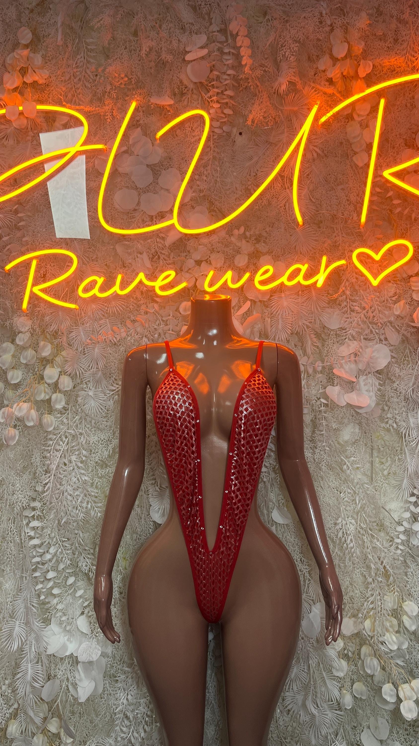 Red mesh thong bodysuit with deep V front and cutout back, festival rave style