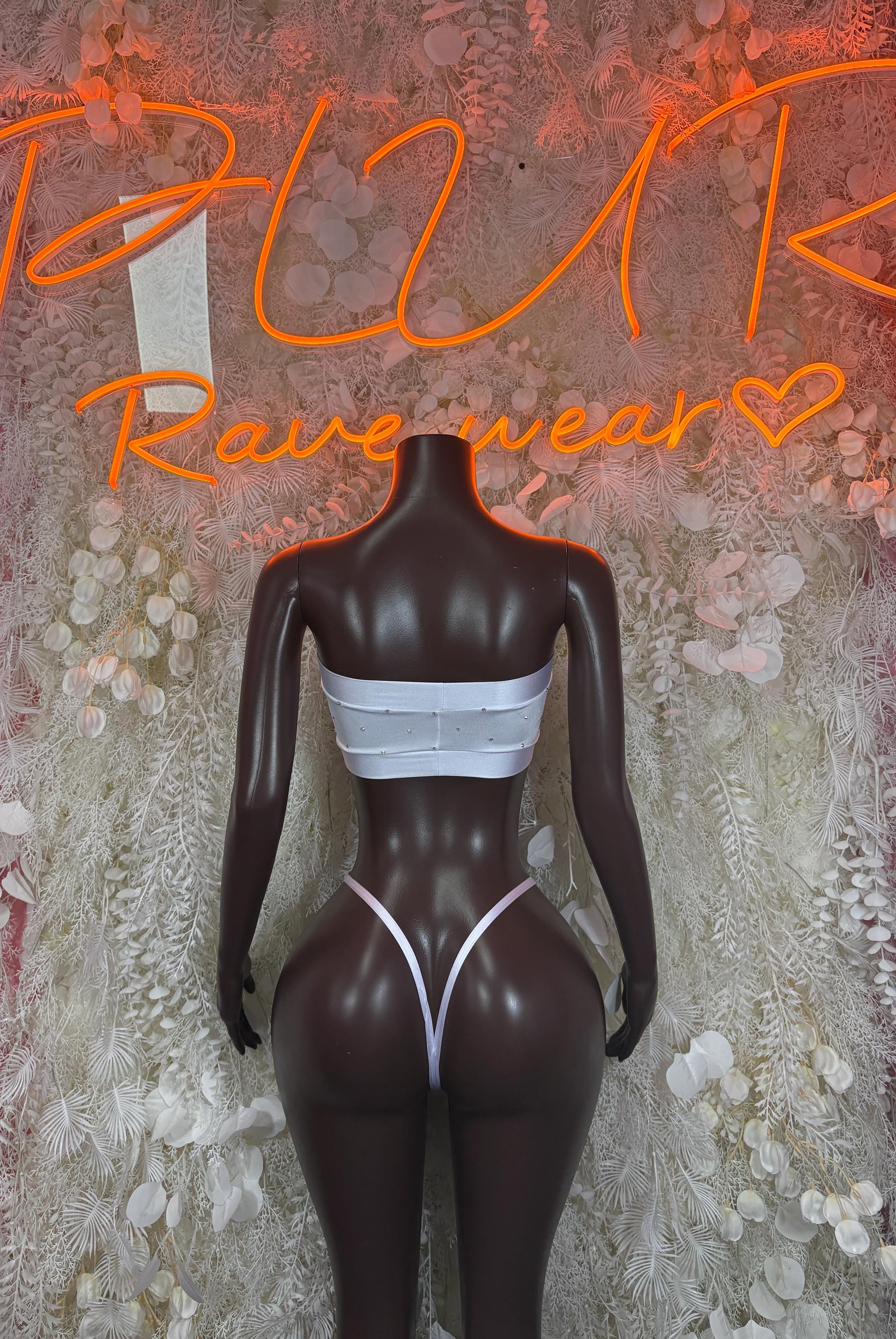 White bikini set with bandeau top and high-cut triangle bottoms on mannequin